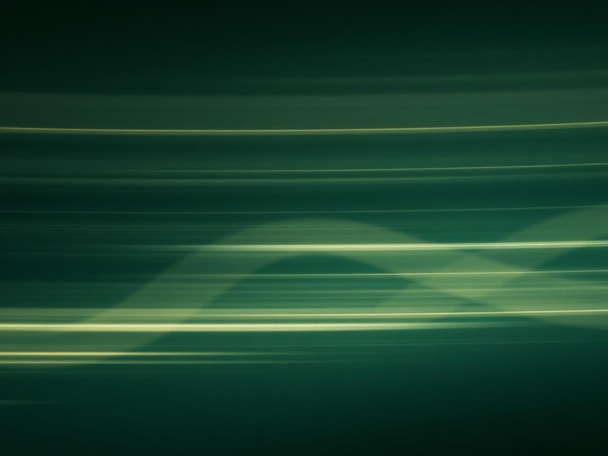 Abstract long-exposure light streaks evoking quiet market motion